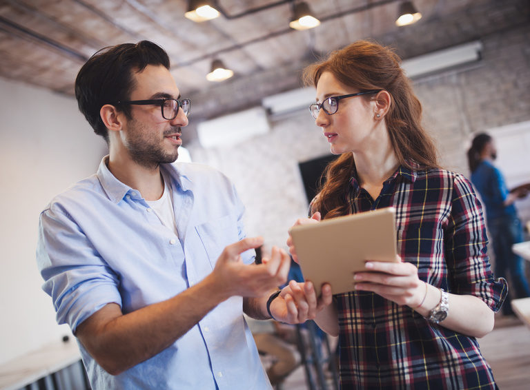 Company coworkers working in office and sharing new ideas